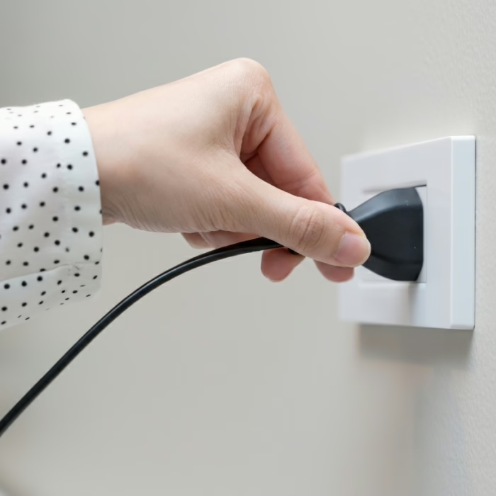 Plugging a portable home comfort device into a wall outlet